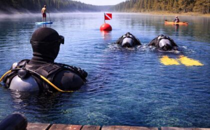 Divers going to flag, watercraft